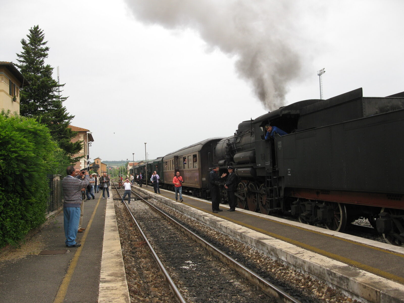 Steam train of the Treno Natura passing through Tuscan countryside near Buonconvento